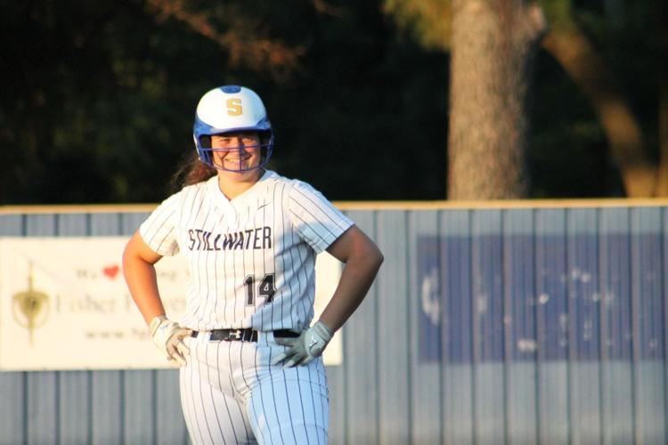 Stillwater High softball player Alexus Elnes-Merriott smiles during a game against Bixby