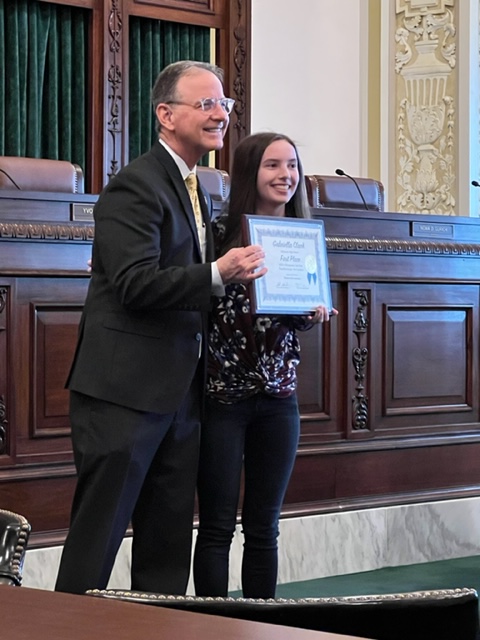 Gabby Clark with Oklahoma Supreme Court Chief Justice M. John Kane IV 