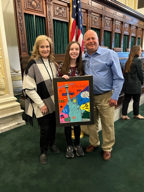 Gabby Clark with Mr. and Mrs. Parker