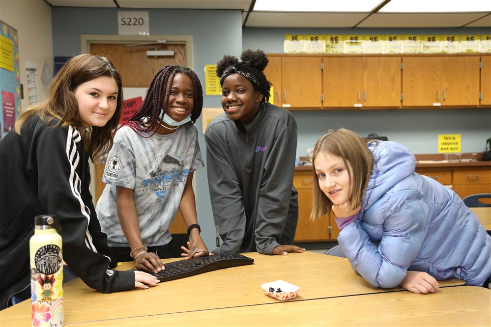 Students gathered around a table