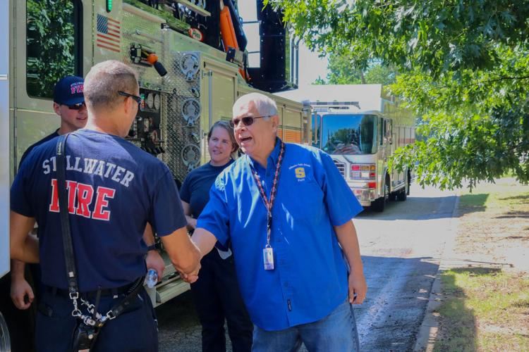  Clayton Tselee shaking hands with Stillwater Firefighters